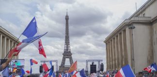 French parliament approves restaurant COVID pass and vaccine rules despite protests – CBS News